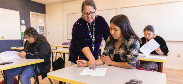 Teacher instructing student
