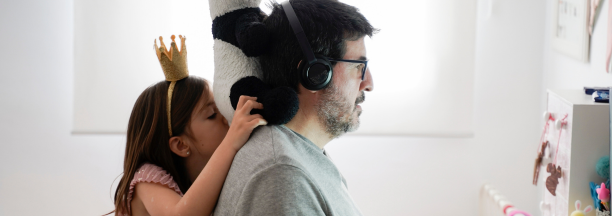 Man and daughter work remotely