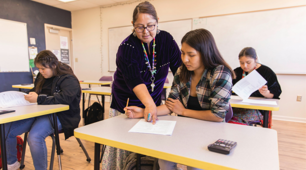 Teacher instructing student