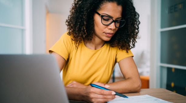 Woman goes through checklist at work