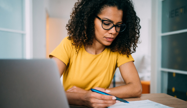 Woman goes through checklist at work